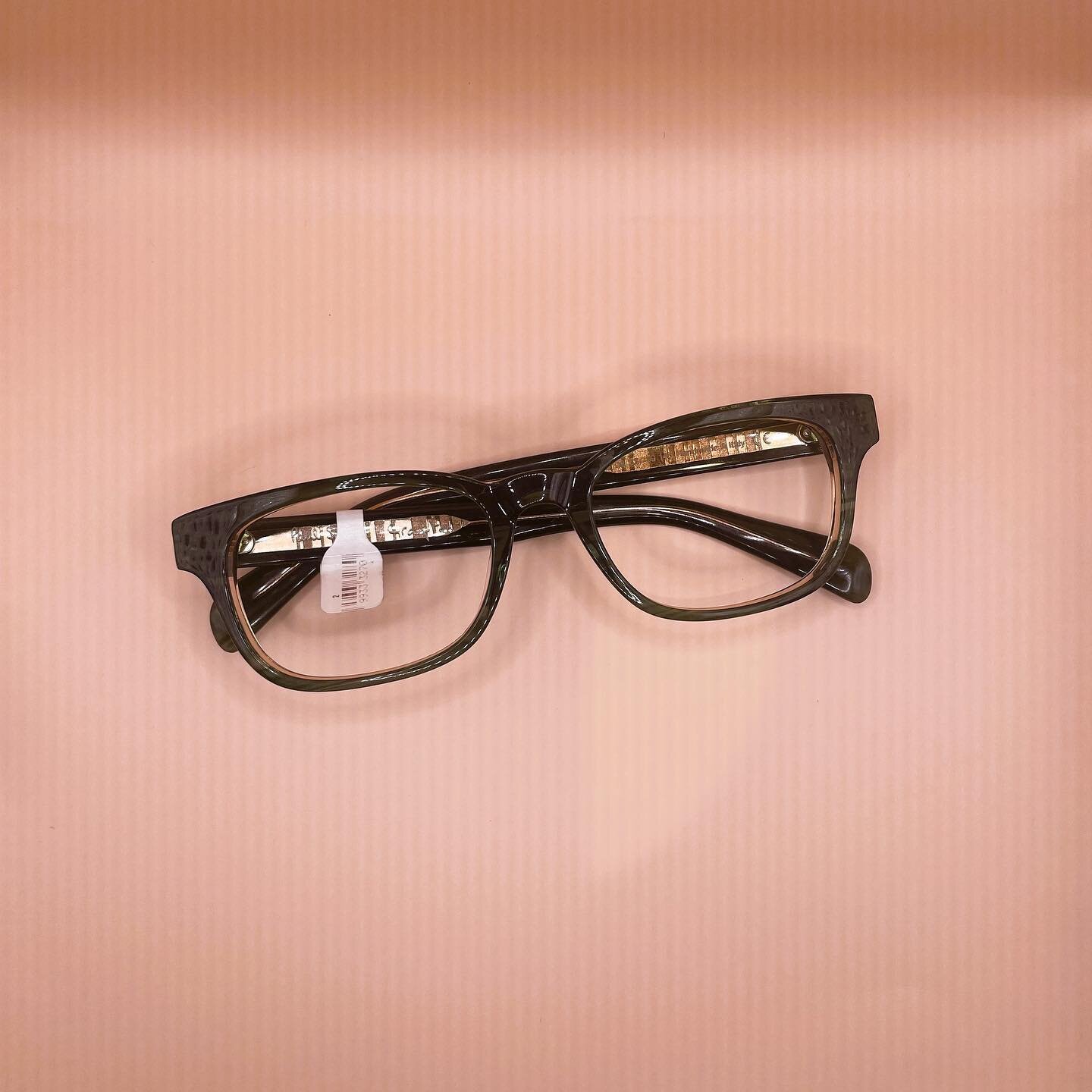 Forest green acetate with gold metal detailing. Need I say more?