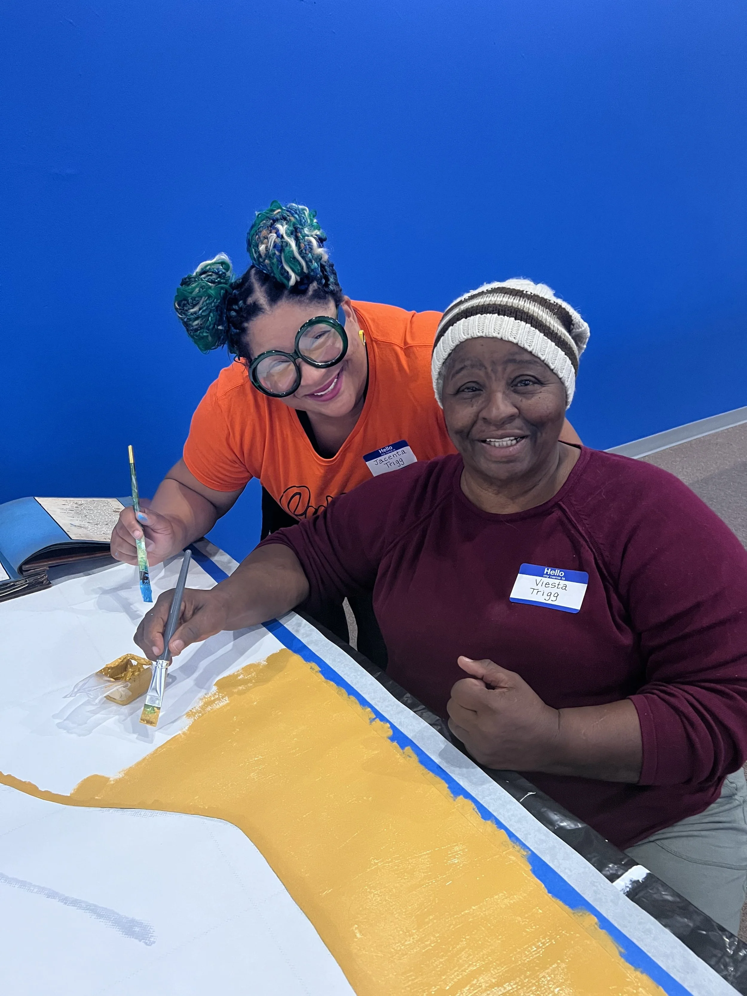 assistant painter Jacenta Trigg with her mom Viesta Trigg, former East End resident.jpg