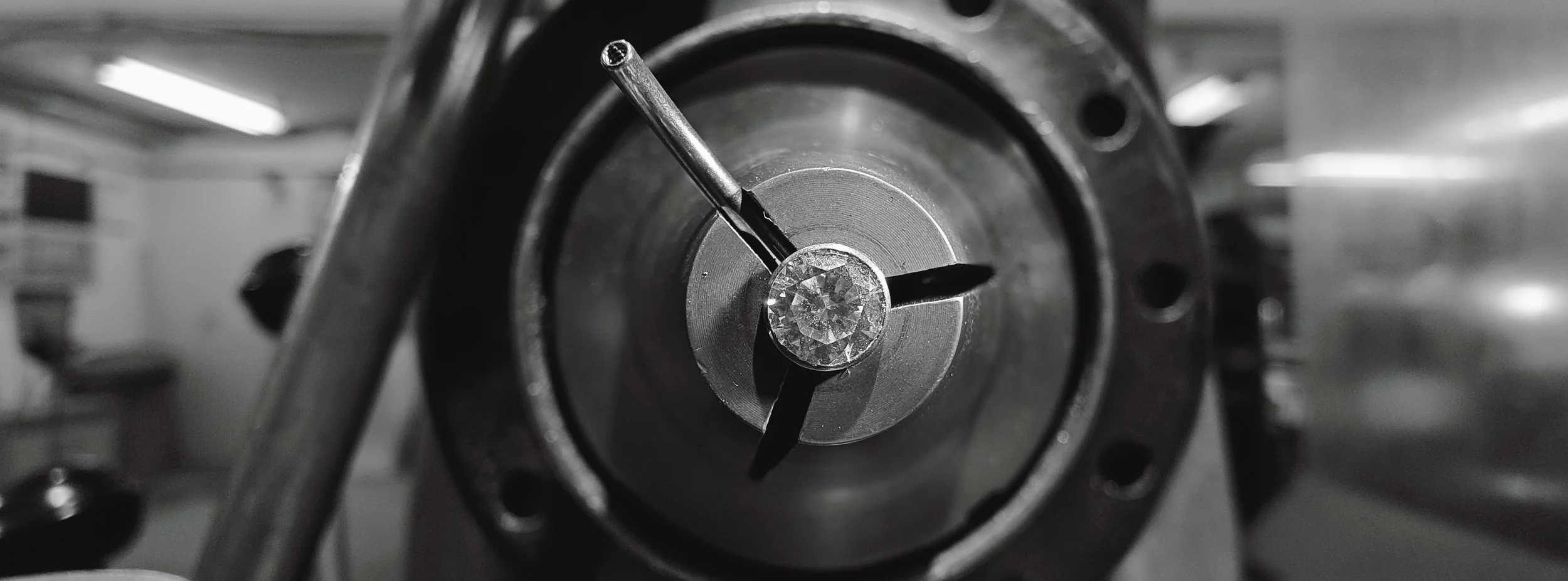 A gem curve clamped into a Hardinge lathe before it goes to the polisher