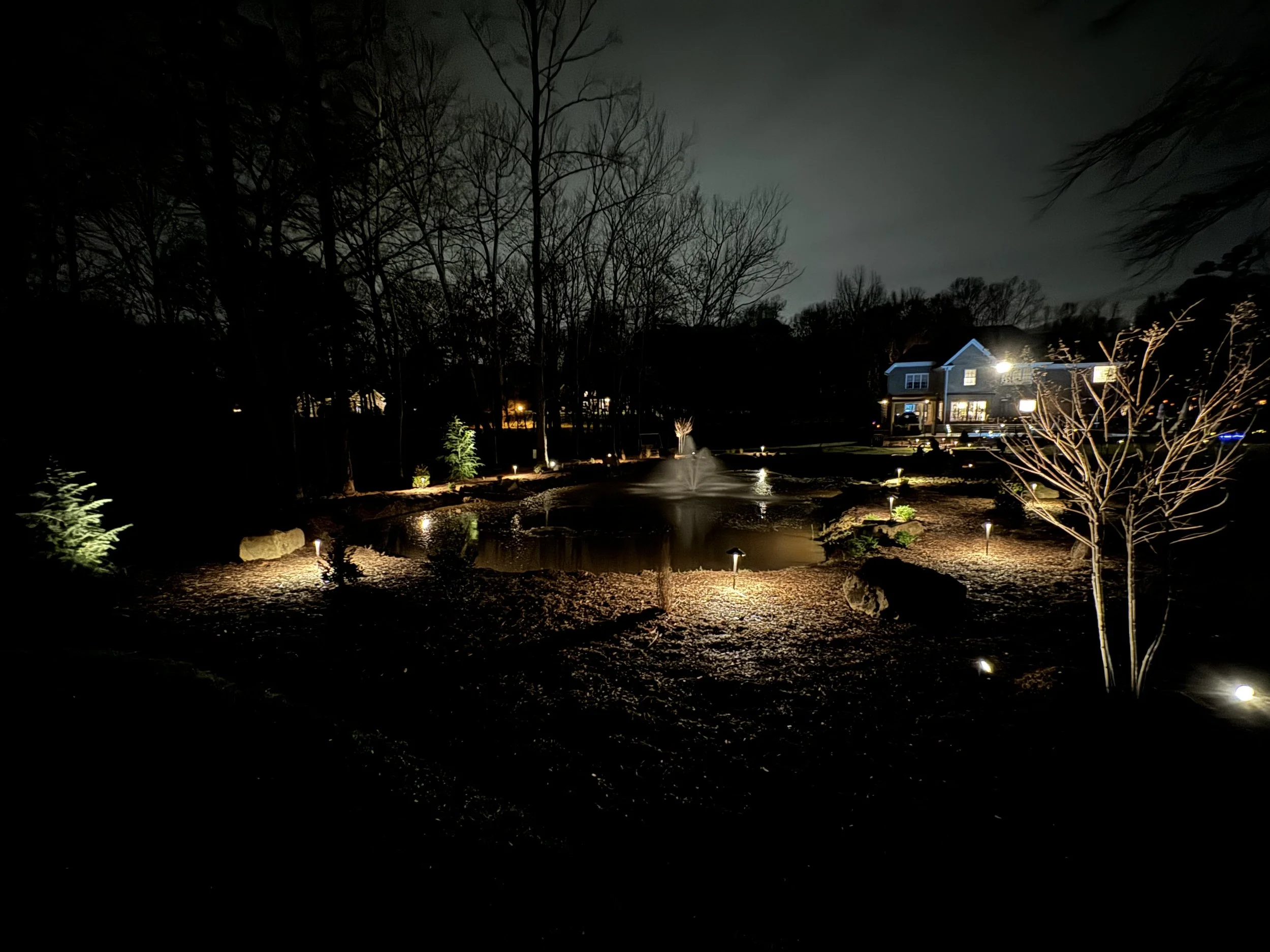 Outdoor lighting on brick home.