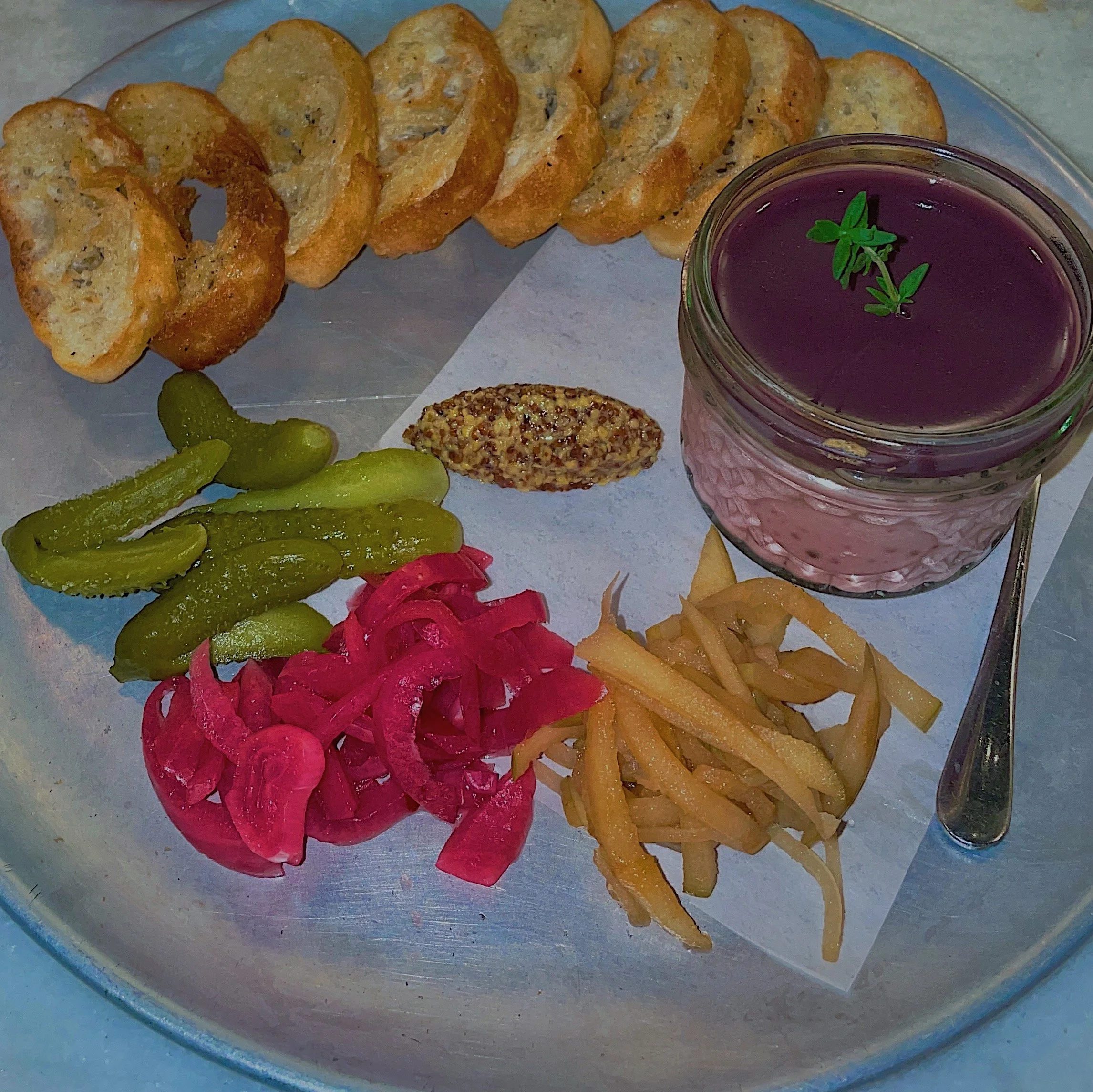 Chicken liver mousse Paté served with crostini, cornichons, pickled apple, whole grain mustard
