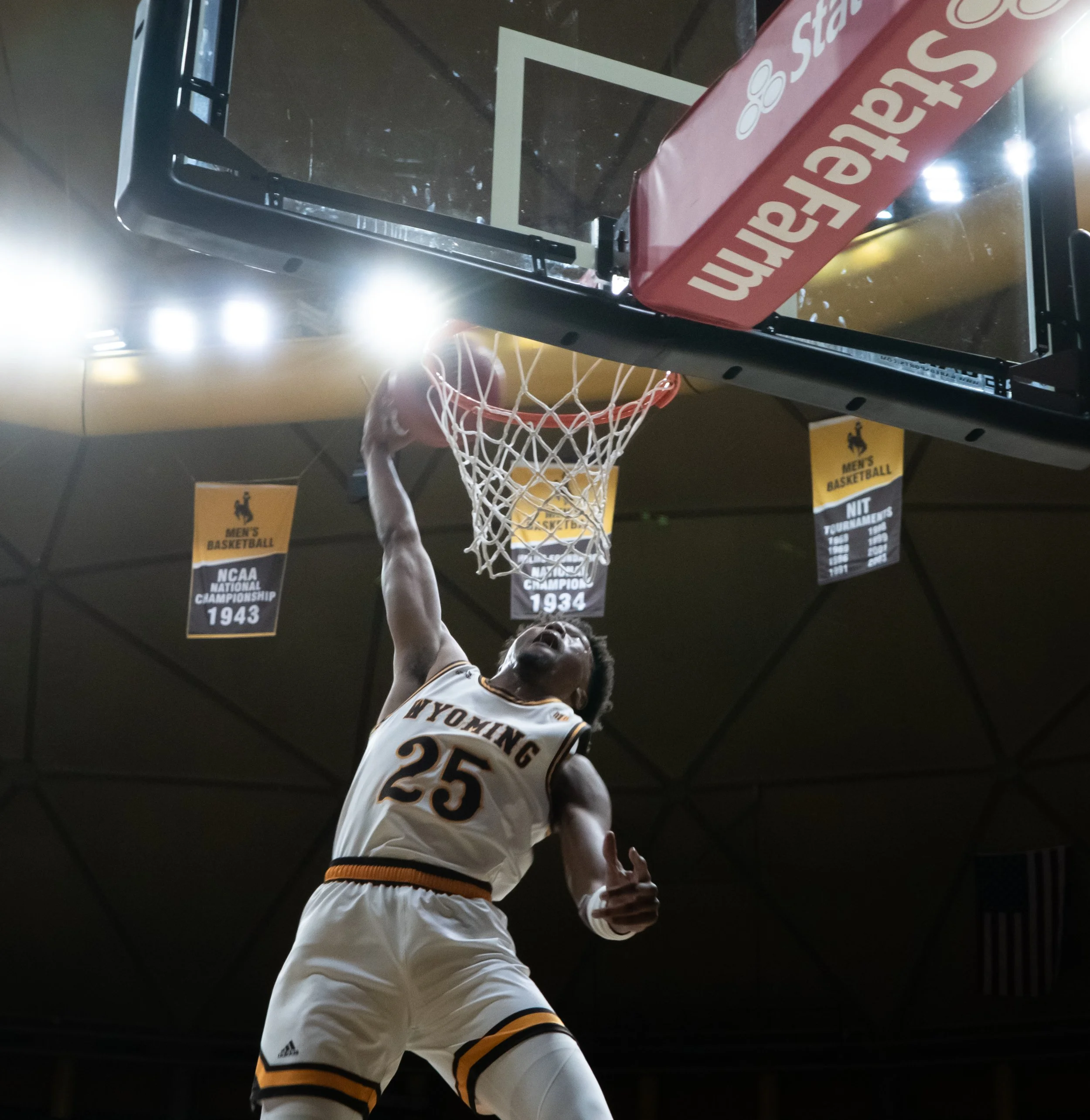 Following a steal, Wyoming Cowboy Noah Reynolds alley-ooped the basketball to sophmore forward Jeremiah Oden (25). The Cowboys beat the Nevada Wolfpack 74-61 on Feb. 26, 2022. Oden finished with ten points and four rebounds.