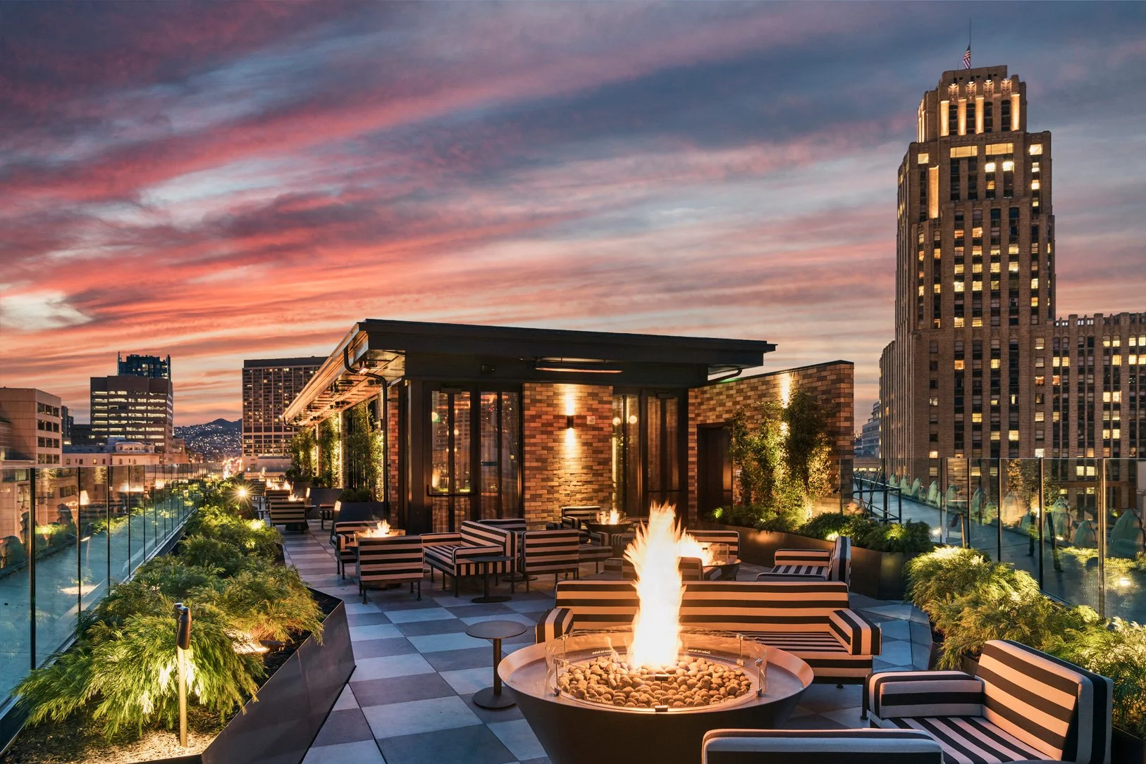 Stylish rooftop bar with sunset sky
