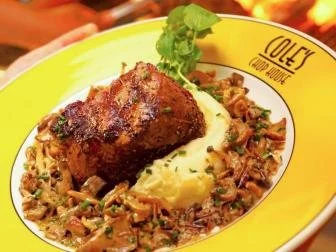 steak meal on a yellow branded Cole's Chop House plate