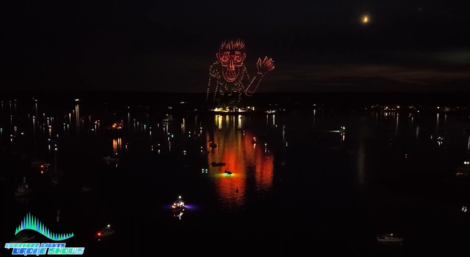 An image from an NLDS drone show depicting a local legend waving to an enthusiastic audience.