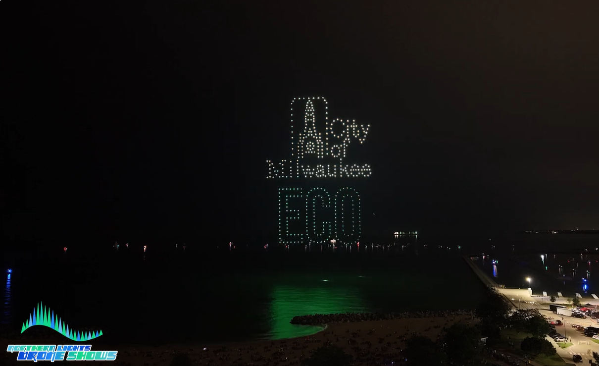 An image from a Northern Lights Drone Shows show  depicting the logo and name of a local entity from Milwaukee that organized the show.