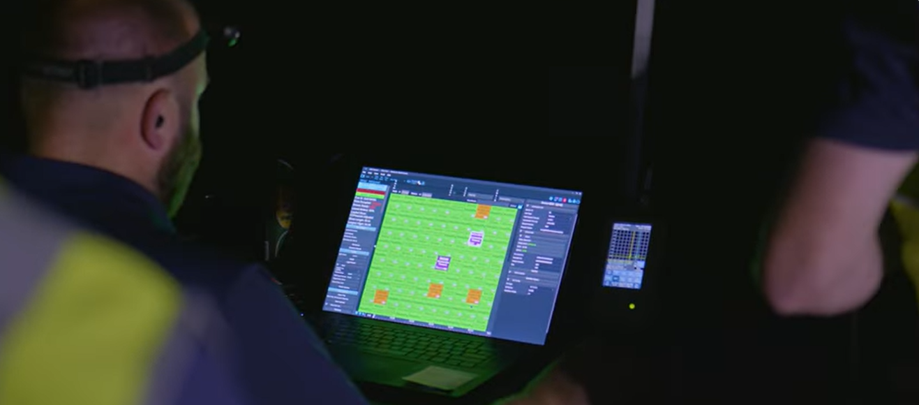 An FAA-certified NLDS pilot overseeing safety protocols during a drone show.