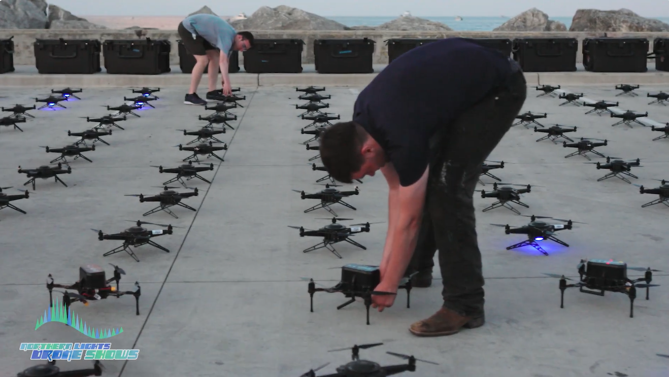 An image depicting an NLDS drone operator setting up for a drone show.