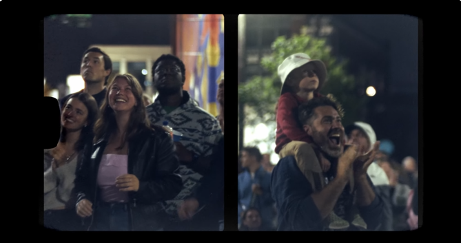 An image of spectators having fun at an NLDS drone show.
