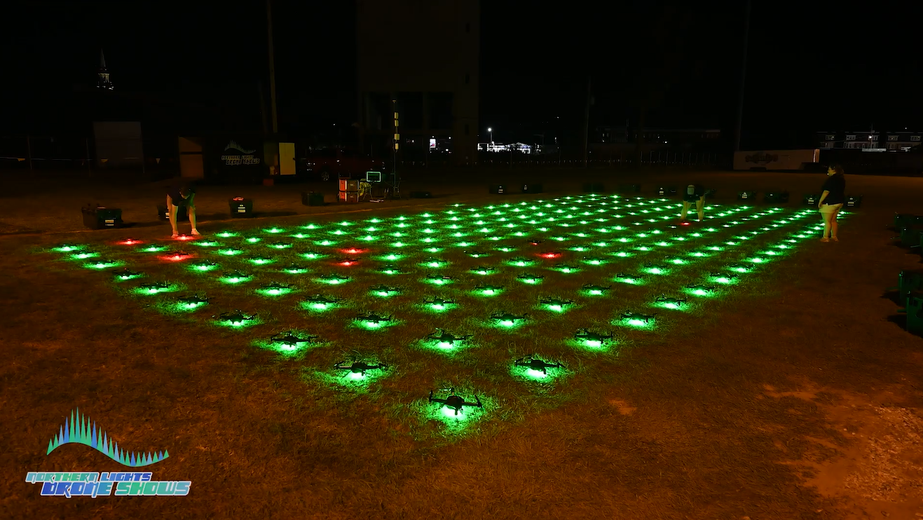 An image depicting dozens of drones undergoing a safety protocol prior to takeoff.