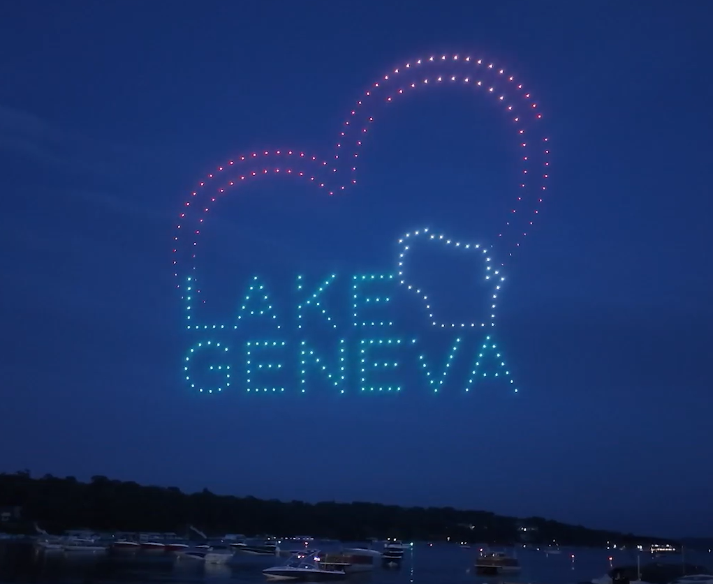 A drone show depicting the words "Lake Geneva" with a heart for a community event.