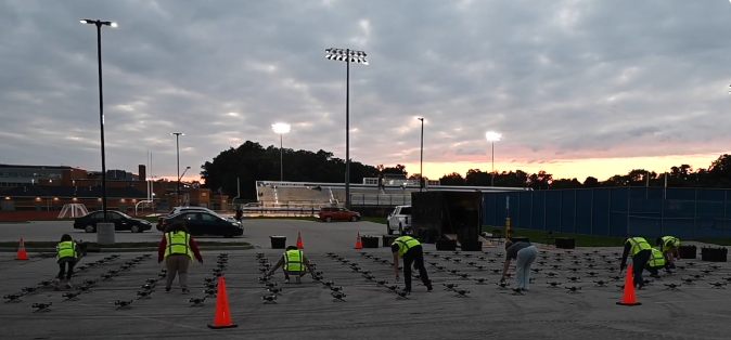 An image from an NLDS drone show depicting our ground crew setting up the drones in a safe area.