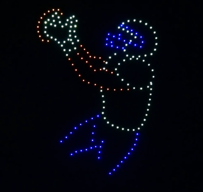 An NLDS drone show depicting a football player diving to catch a ball that flies across the sky.