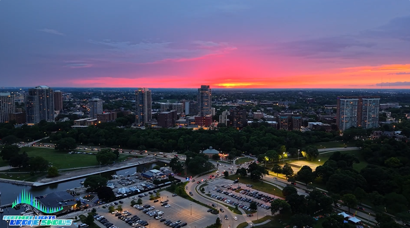 An image from an NLDS drone show prior to the event taking in a sunset over a city.