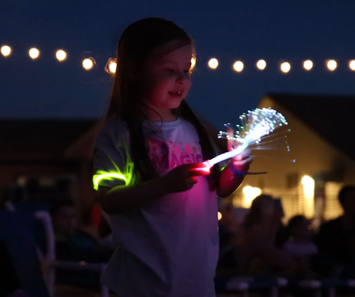 A happy child watching an NLDS Drone Show.