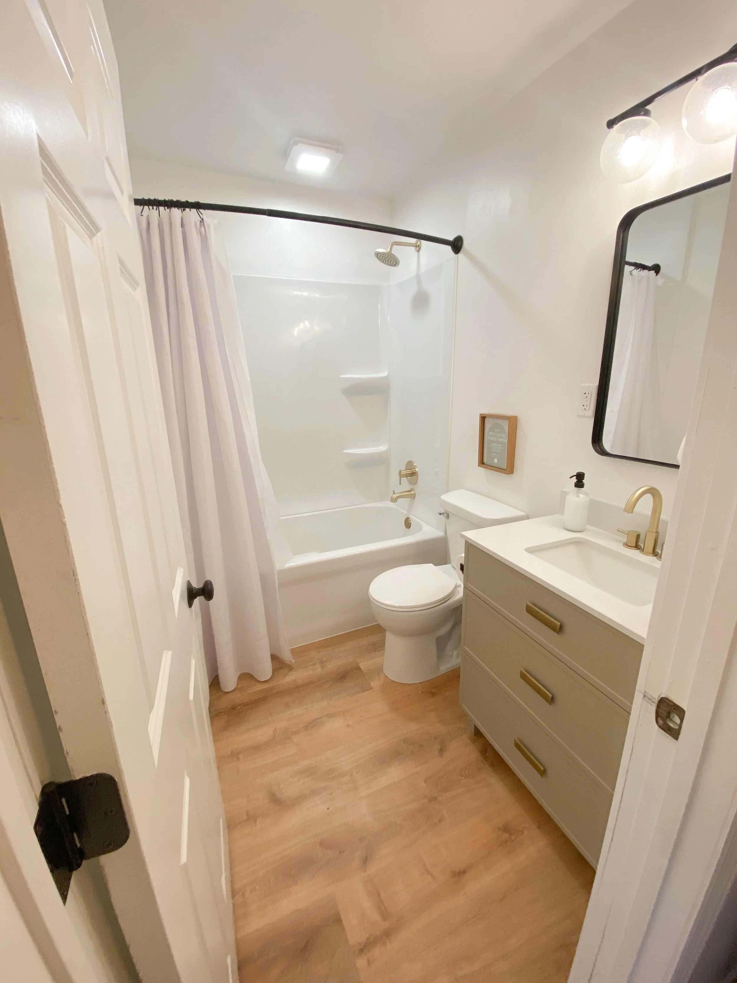 Tub-shower, vanity, lighting, flooring, trim and more. 