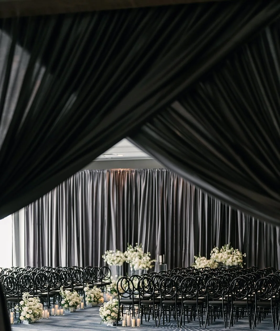 A grand ballroom framed by soaring windows and soft, sweeping drape. A ceremony that perfectly captured our couple&rsquo;s style:  timeless, romantic, and effortlessly elegant.
 
Photo: @zhazha 
Planning &amp; Design: @lorelleevents 
Florals &amp; Fl