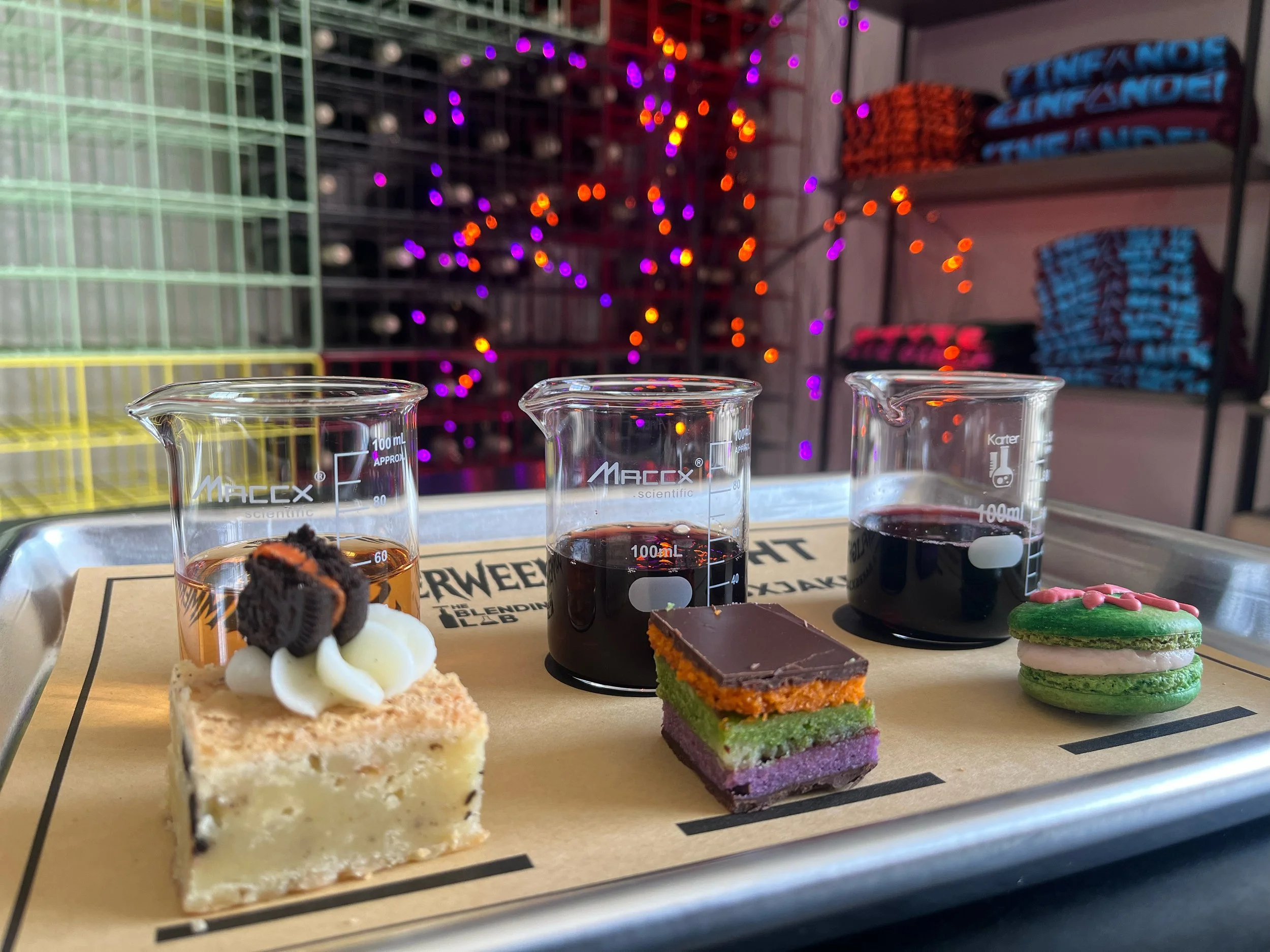 photo of a flight of wines and flight of sweets