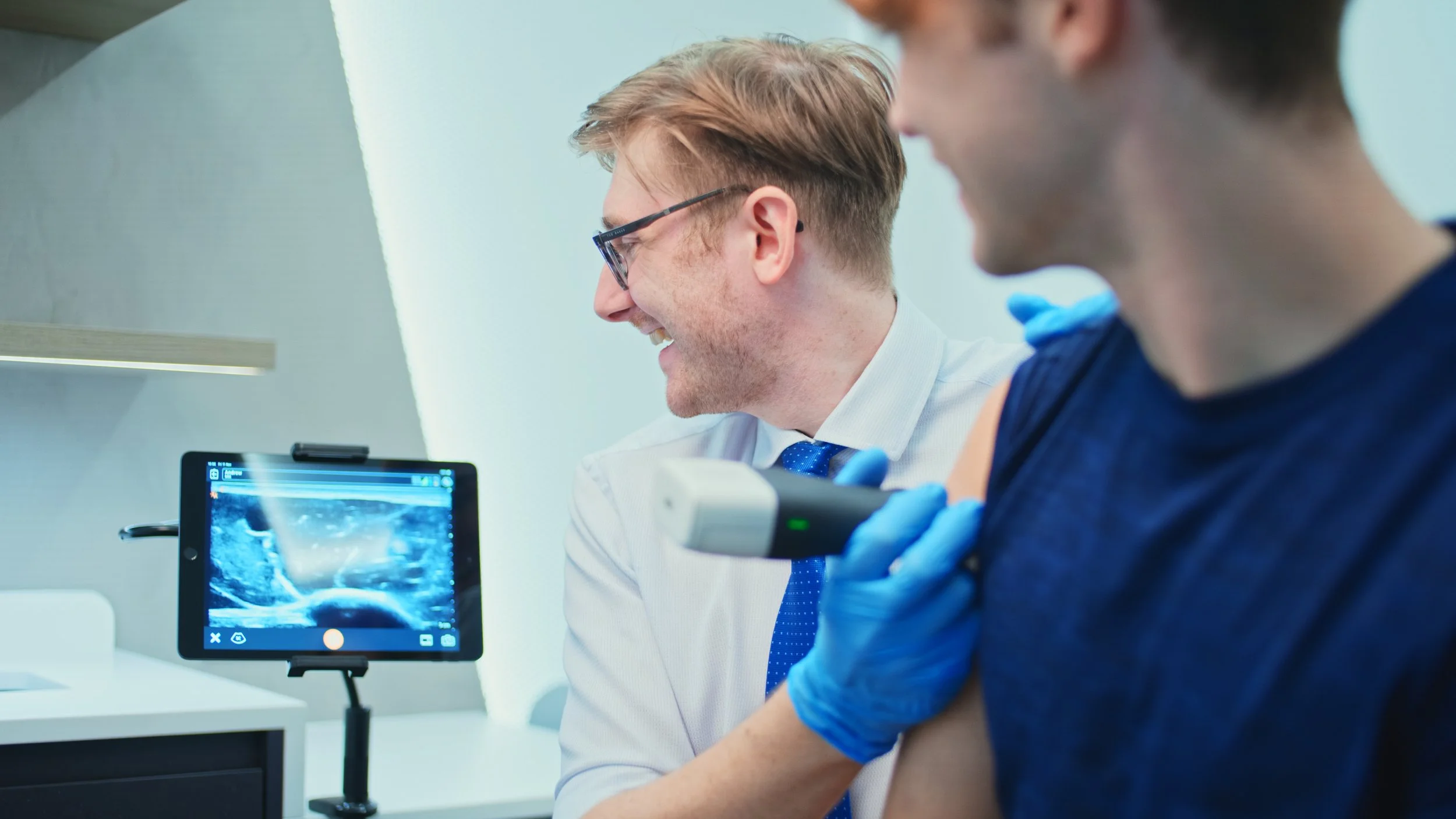 Diagnostic ultrasound scan of shoulder bursitis being performed in clinic to assess inflammation and guide diagnosis and treatment planning.