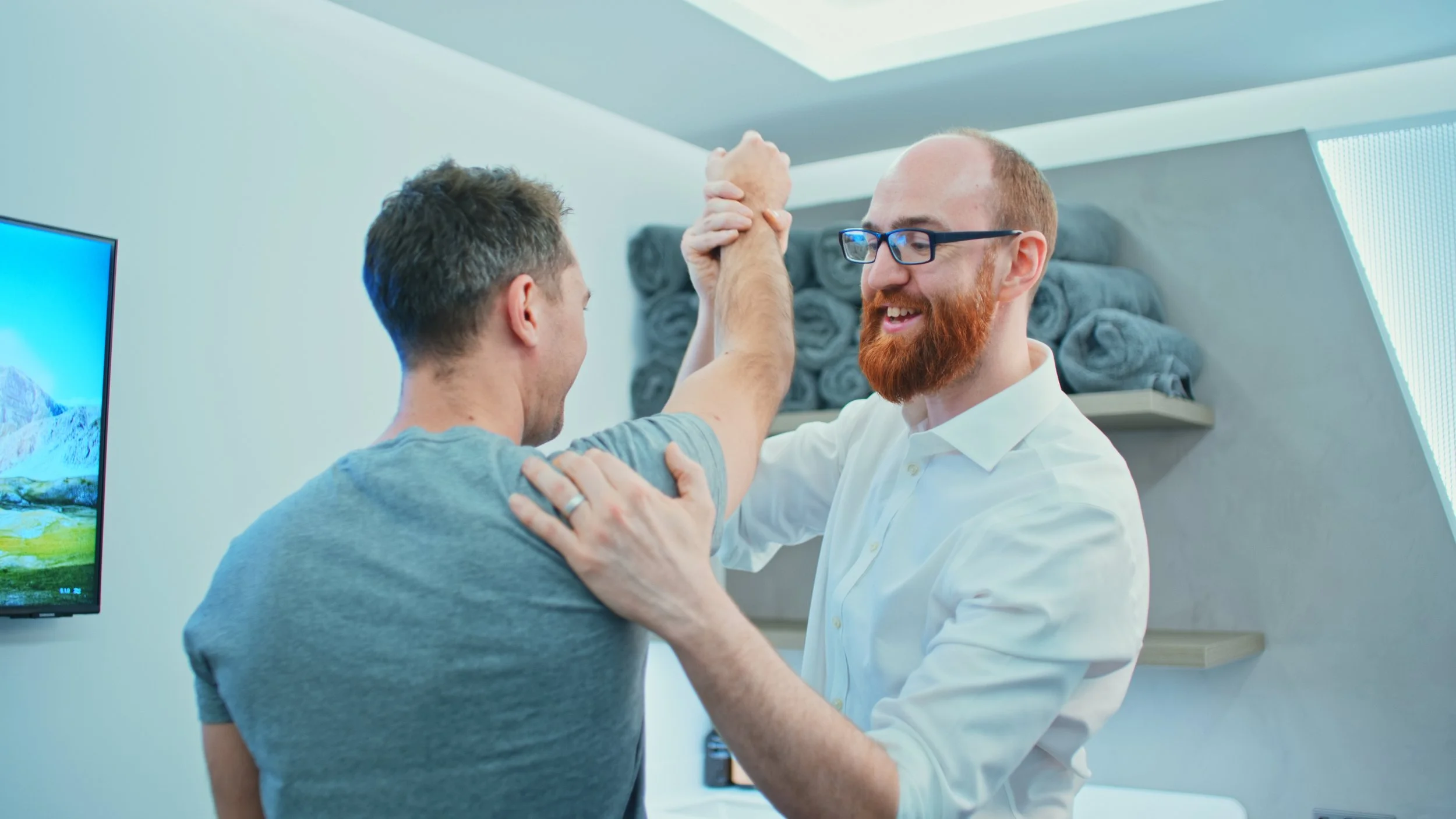 Jon Cairns performs a shoulder exam