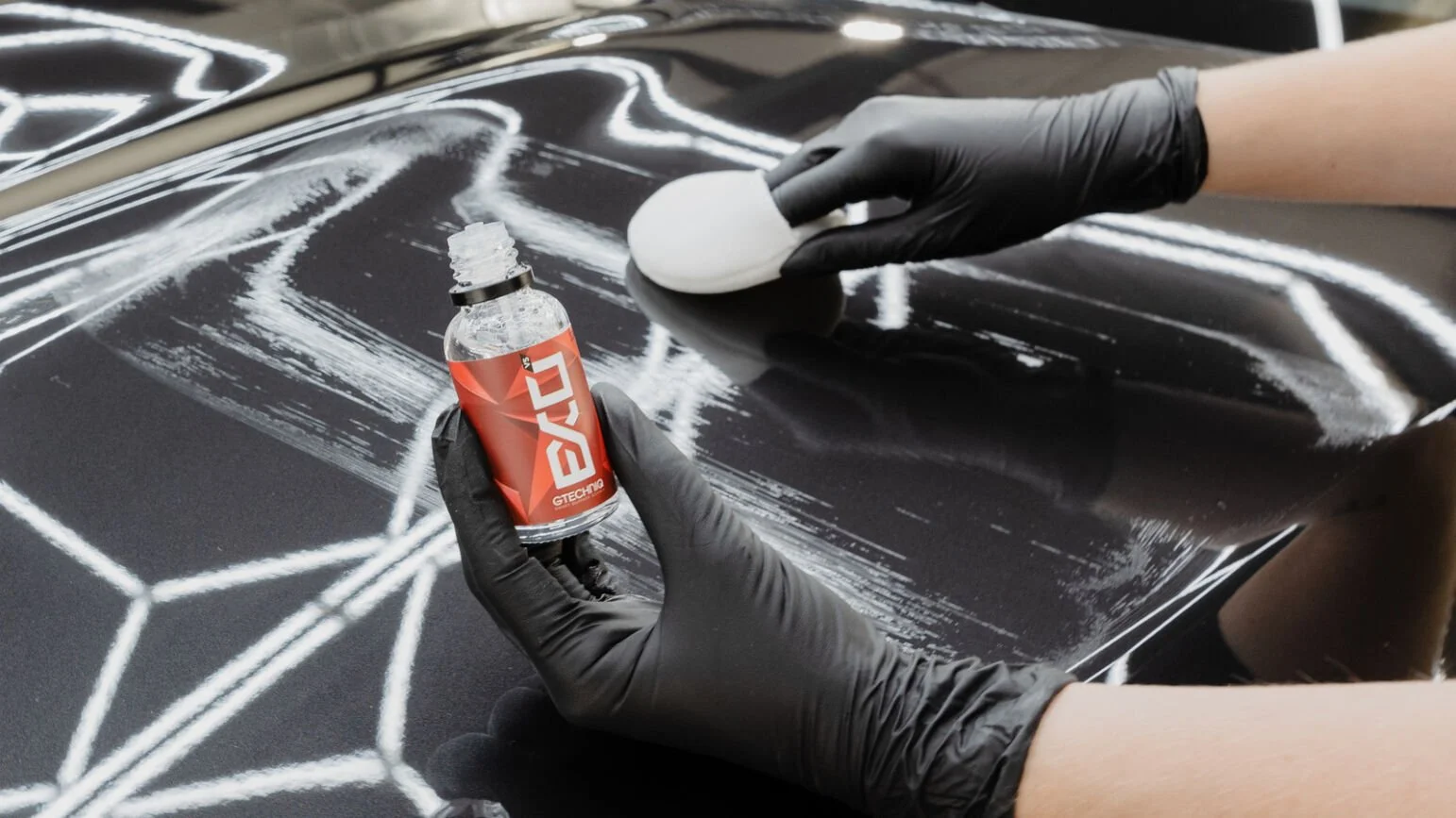 Installing Gtechniq EXOv5 ceramic coating on a gray BMW in Baldwinsville, NY.