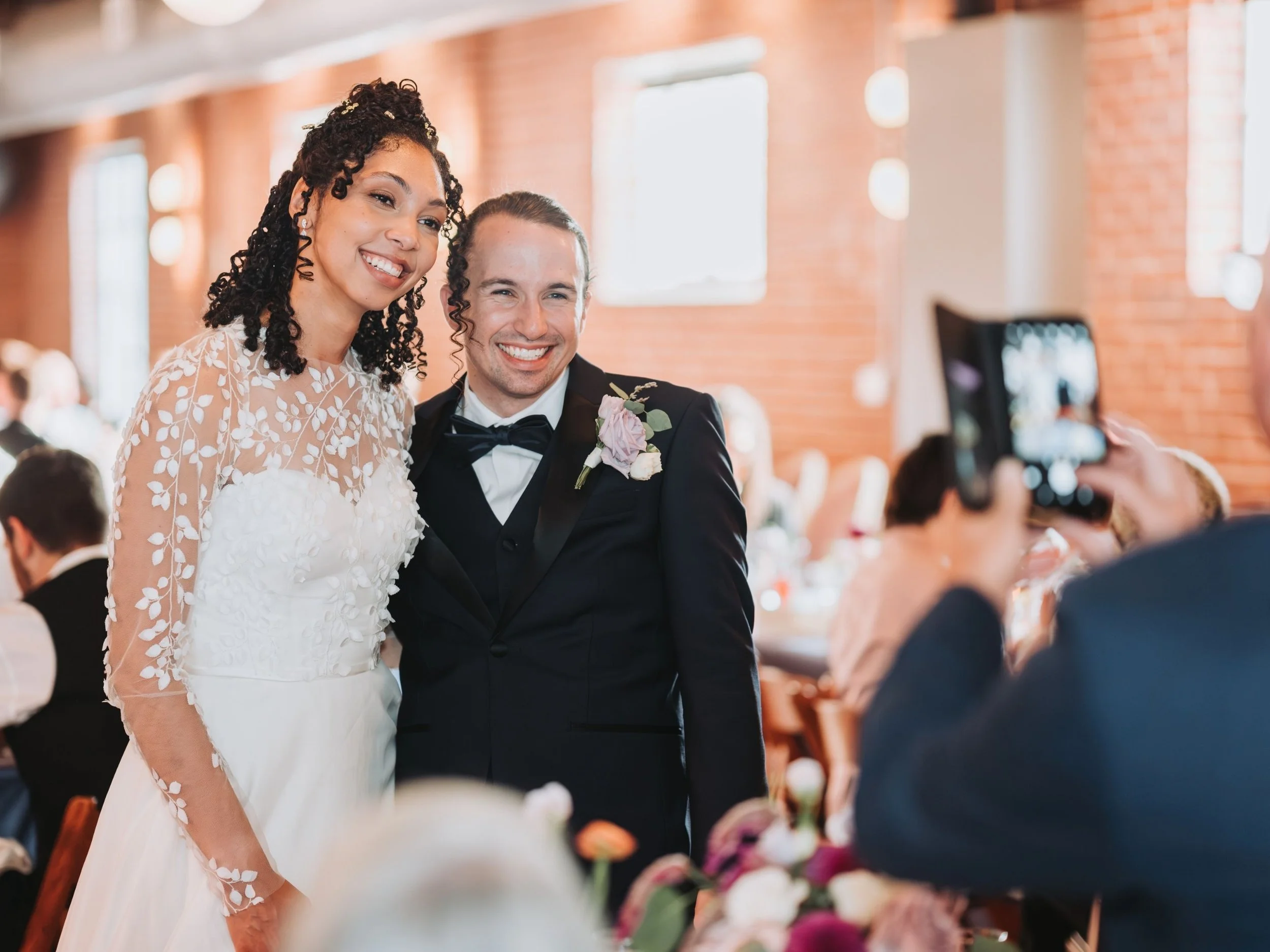 Newlyweds smiling together during their wedding celebration.