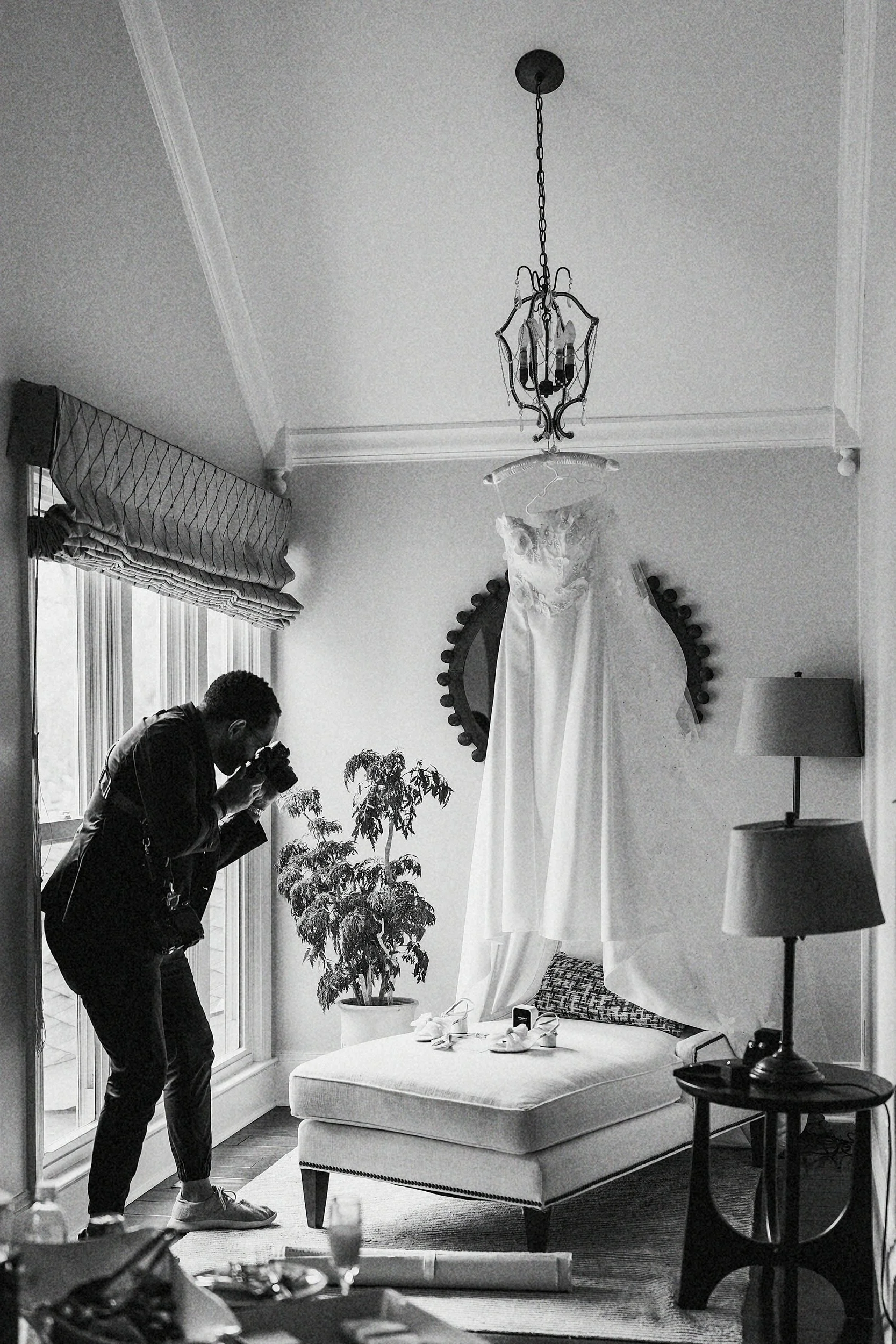 John Branch IV Raleigh Wedding Photographer taking photos of a wedding dress