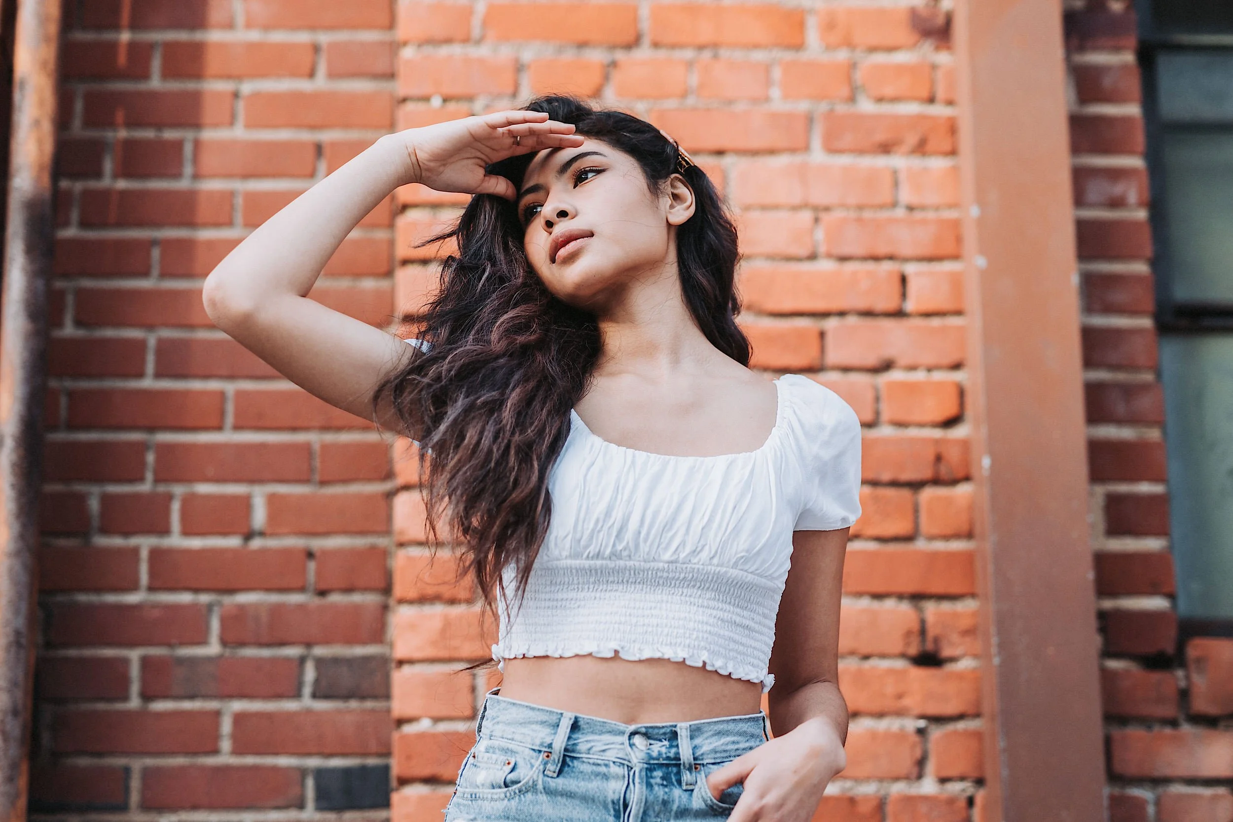 Natural Feels Preset portrait of woman in front of brick wall