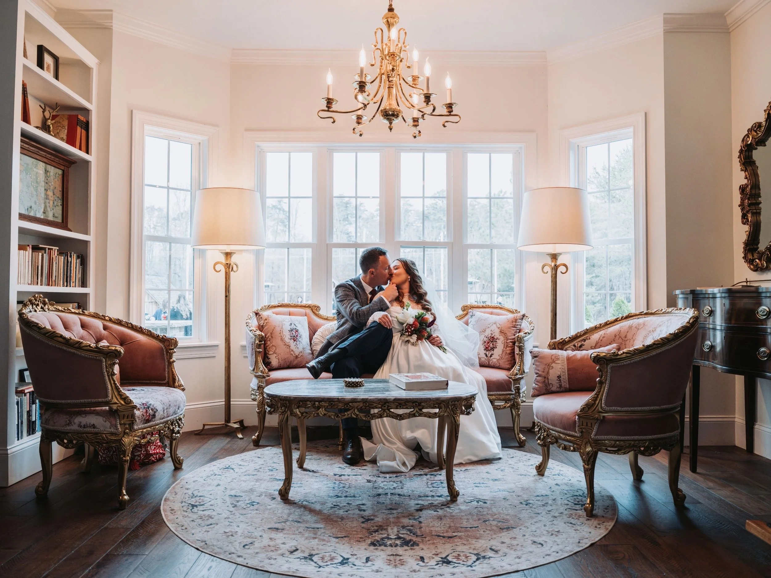 Bride and groom sharing a quiet moment inside their wedding venue.