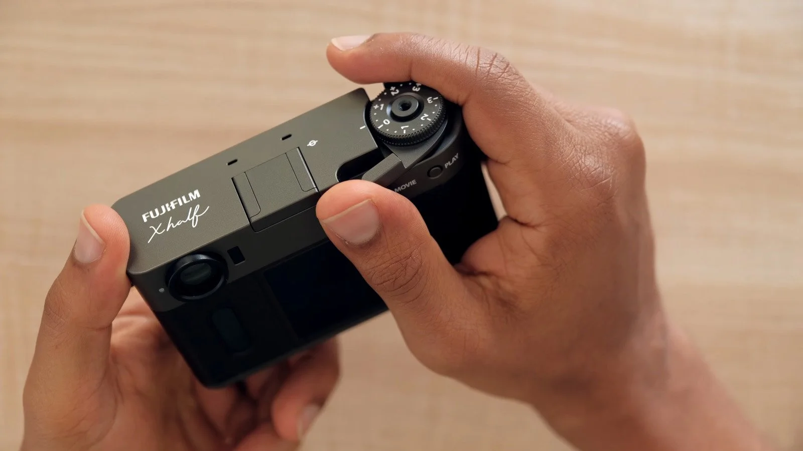 Close-up of the Fujifilm X Half showing the top dial and crank feature.