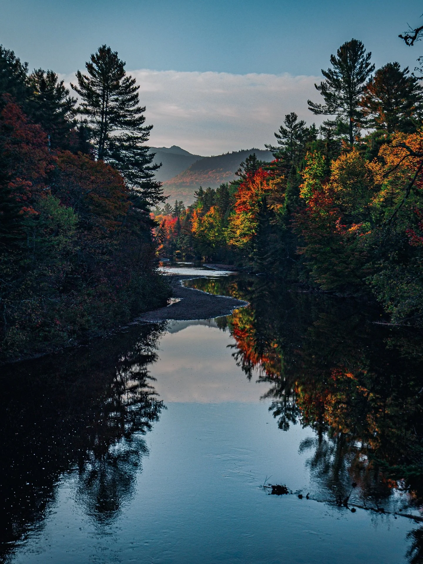 Hello, October! 🍁

I thought this photo would be perfect for the first day of the month. I took this shot early in the morning somewhere in the mountains, and I couldn&rsquo;t get over how the sky and the autumn colors reflected so perfectly on the 