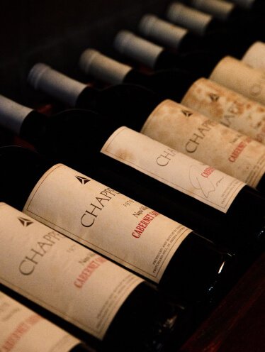 an array of Chappellet Cabernet Sauvignon bottles in their cellar.