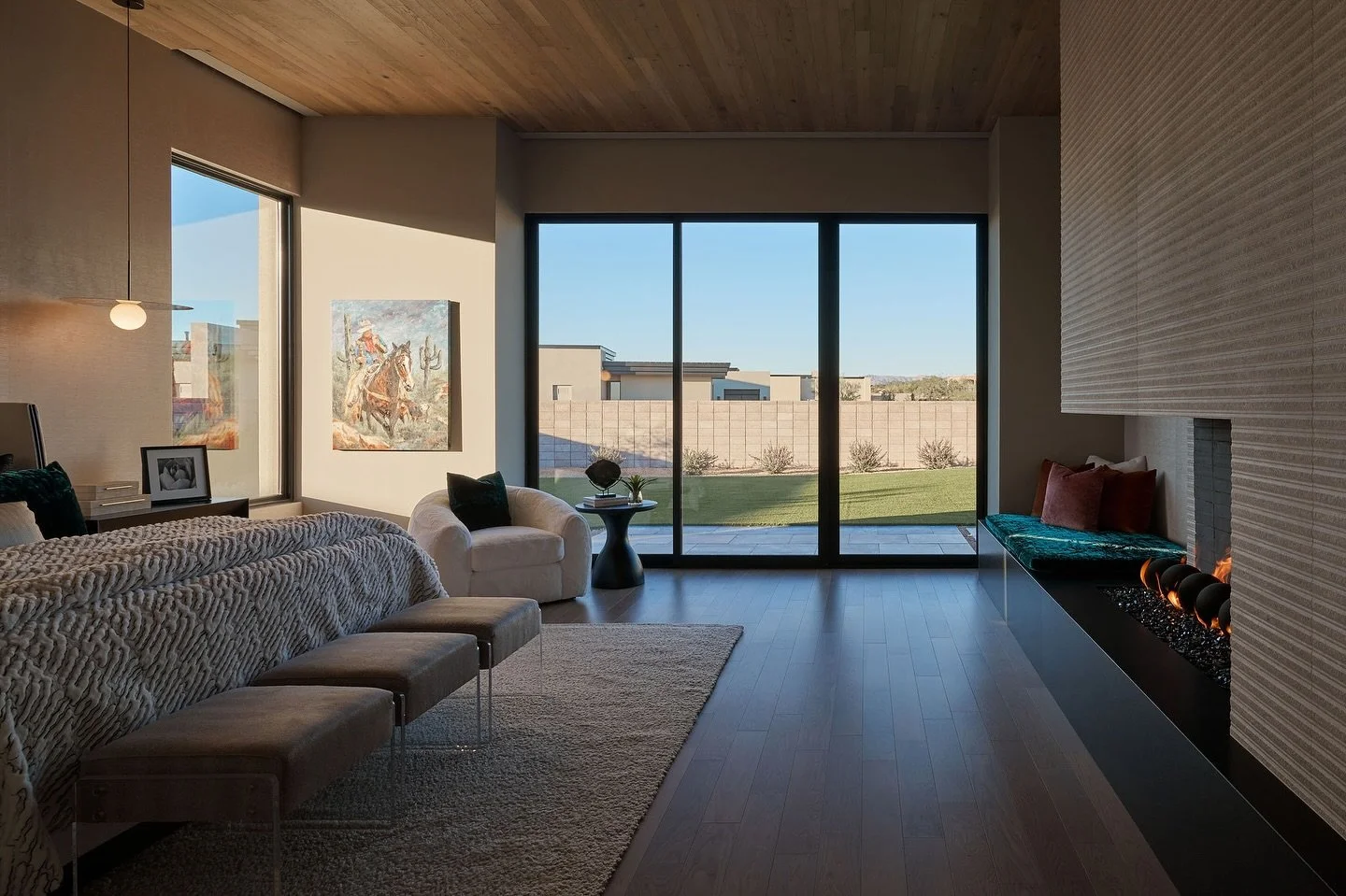 A primary suite with a cozy fireplace feels instantly homey, especially with breathtaking sunset views &amp; access to your own backyard oasis 🫶🏽