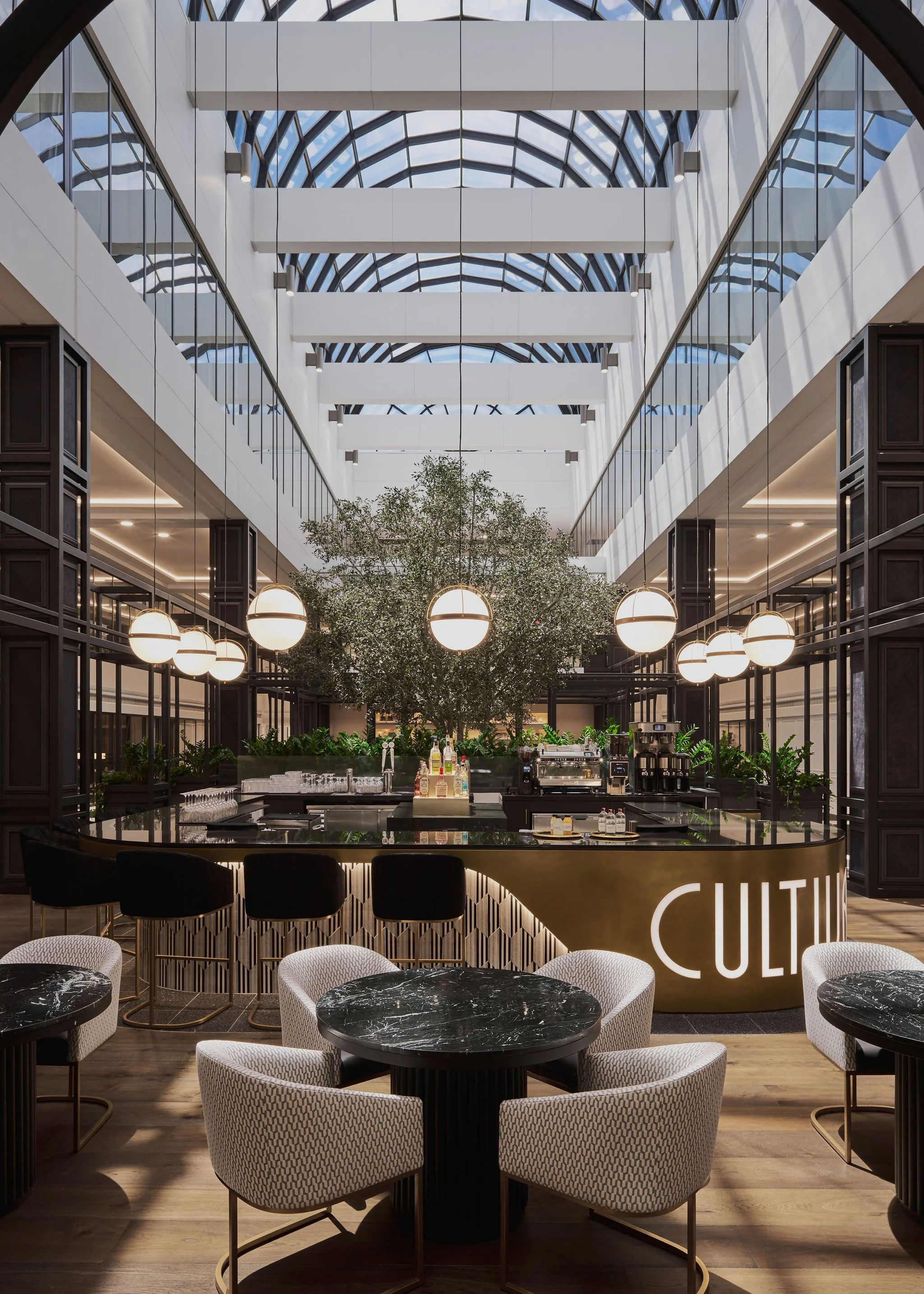 Large architecturally stunning commercial office building, view of a restaurant and bar