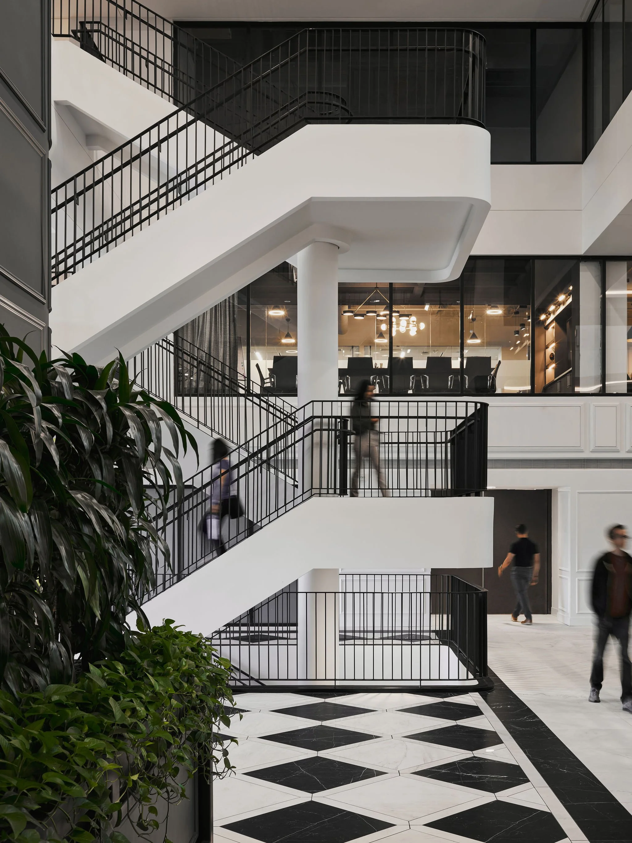 architectural image showing models moving through a space 