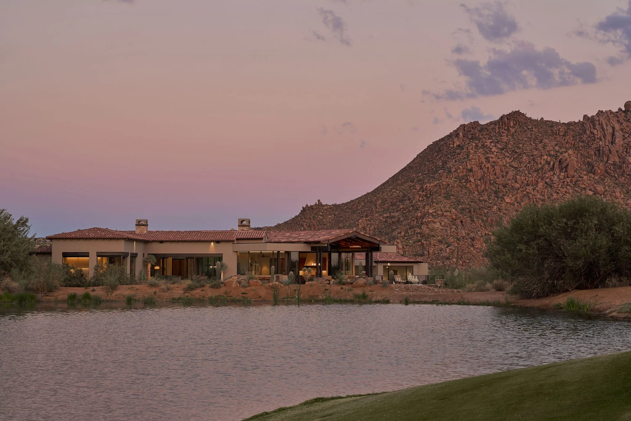 modern desert home at sunset with view