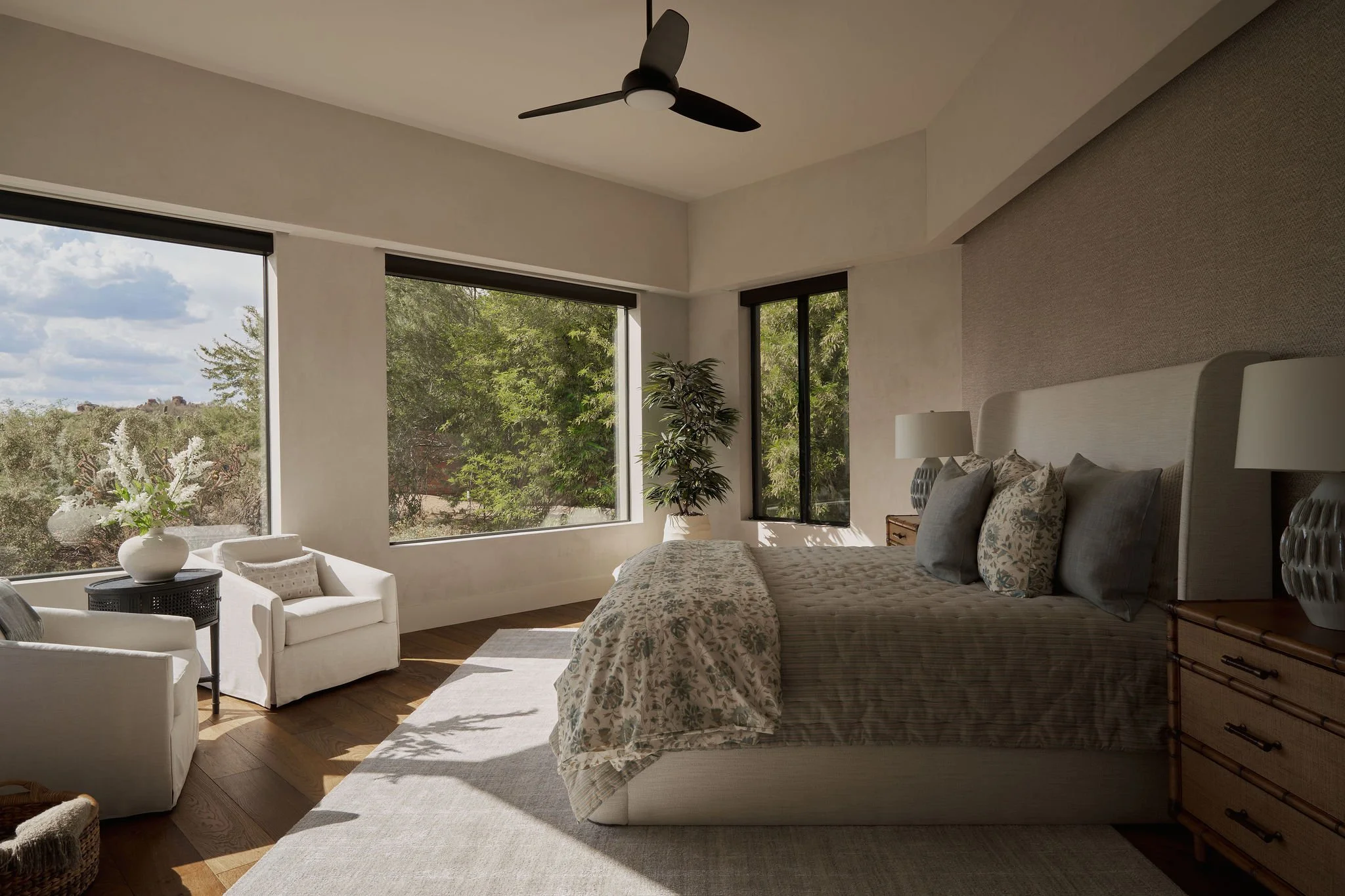 Primary bedroom in architectural home with desert views