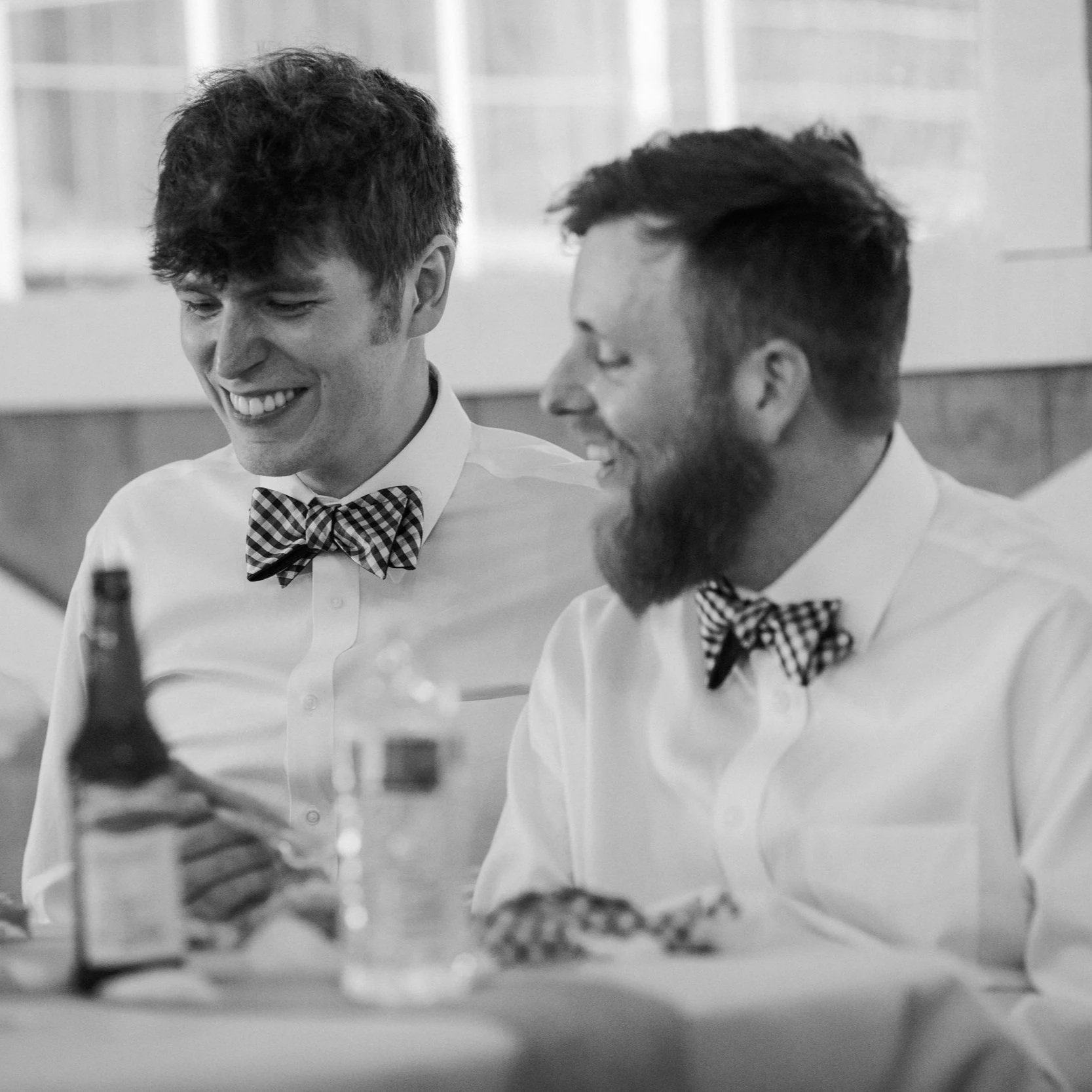 Candid photo of Erik and Joseph at their wedding in 2017