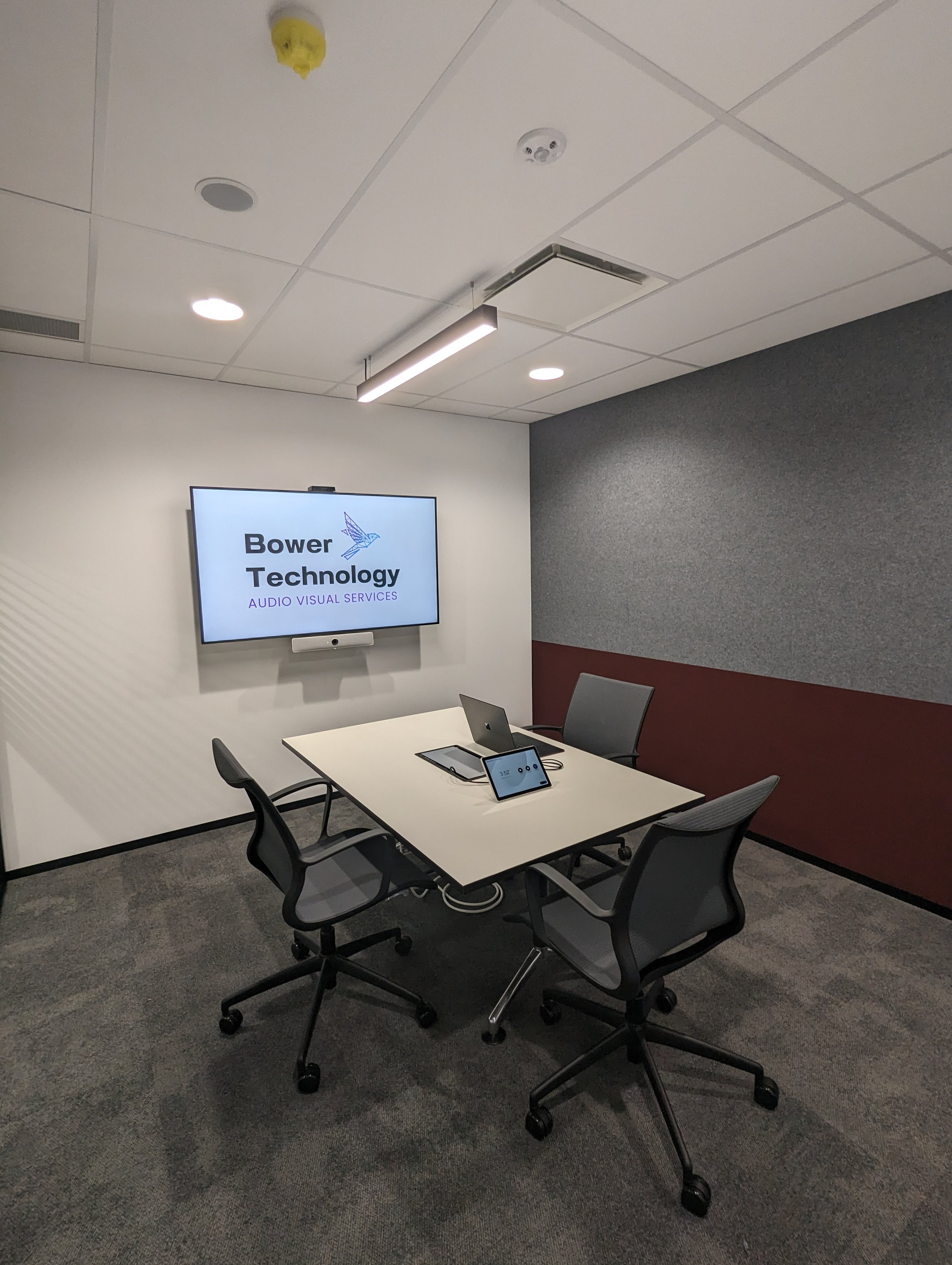 Corporate boardroom with Cisco Webex conferencing system: Cisco Room Kit, with Cisco Table Microphones and Cisco Navigator Control Panel