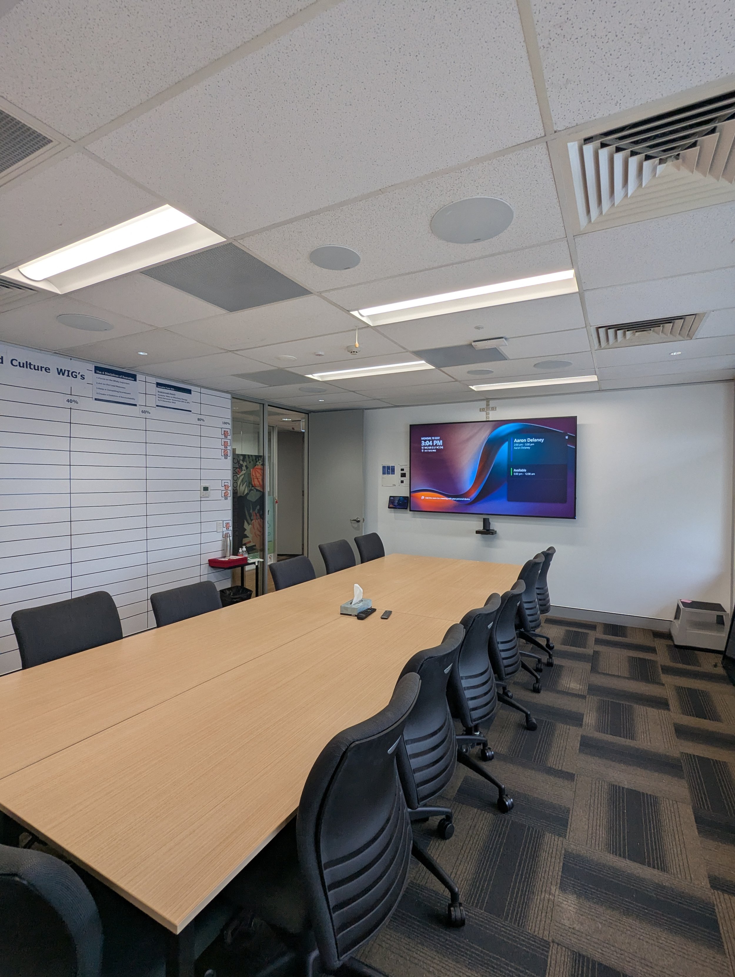 Training room with presentation display and integrated audio-visual system.