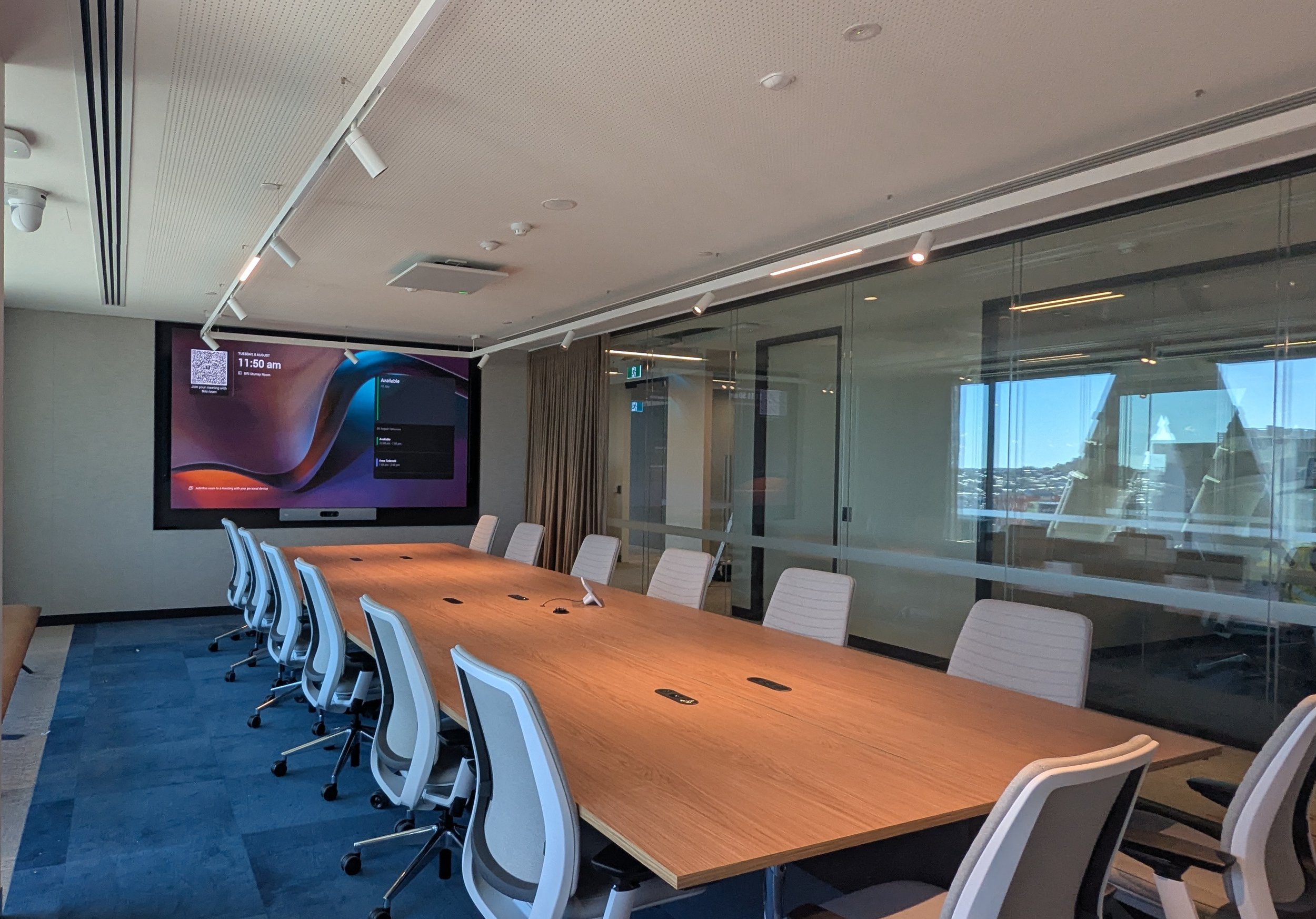 Corporate boardroom with Microsoft Teams Rooms conferencing system and fine pitch Samsung LED wall display, QSYS and Shure audio and Cisco VC