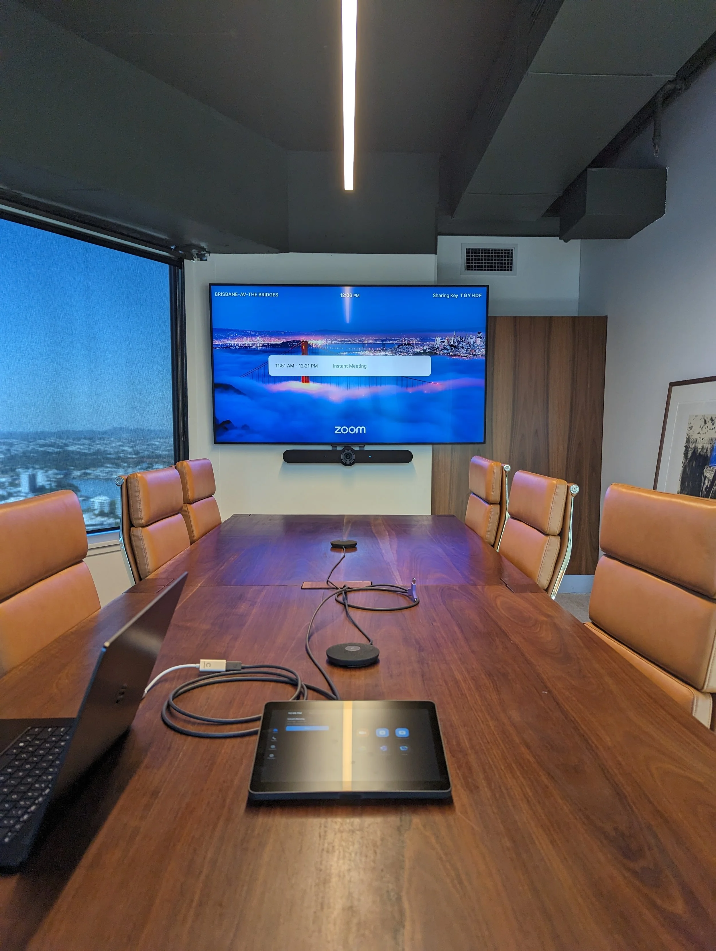 Corporate boardroom with Zoom Rooms conferencing system and BYOD conferencing with Logitech Rally