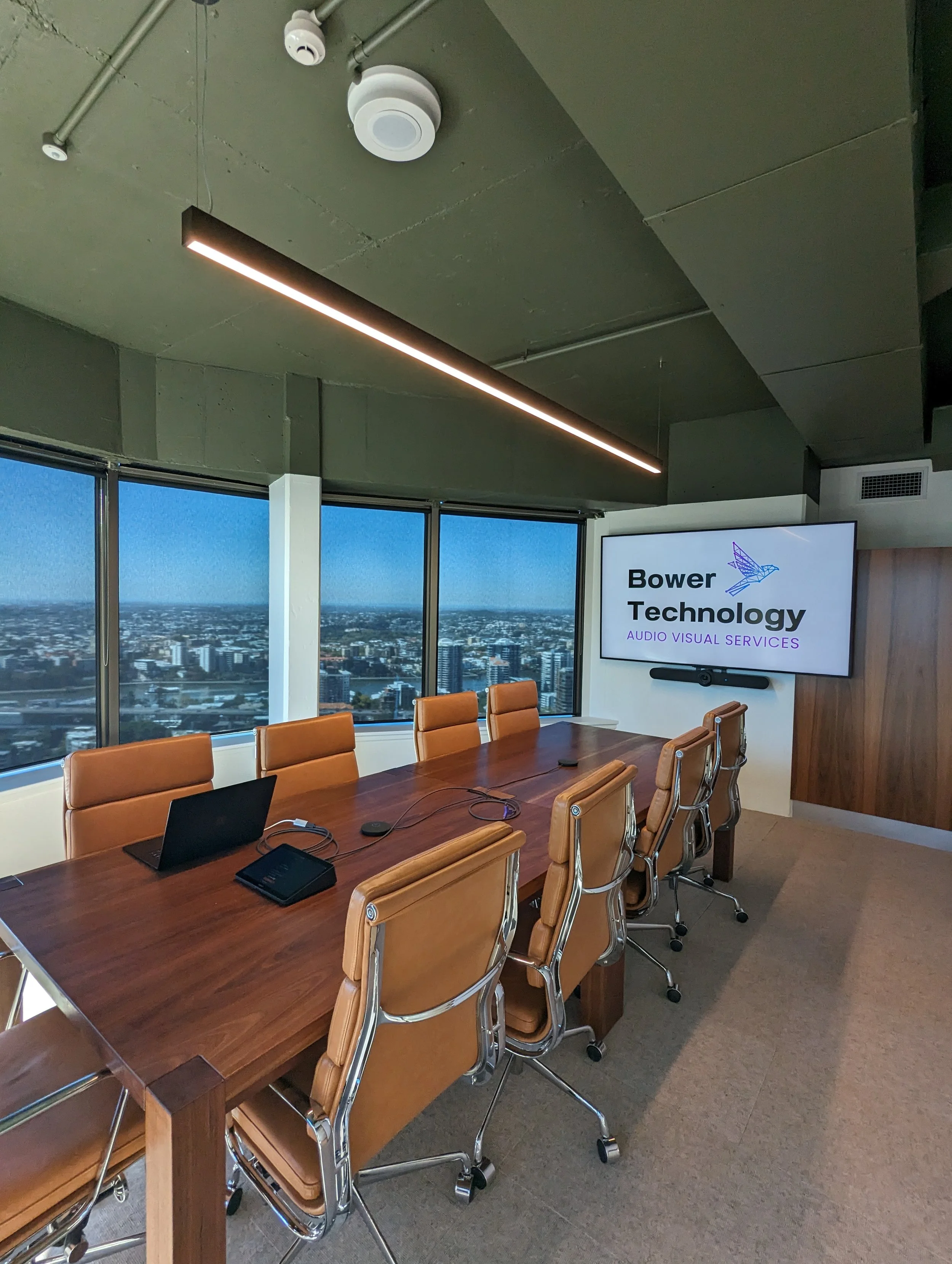 Corporate boardroom with Microsoft Teams Rooms conferencing system and BYOD conferencing.