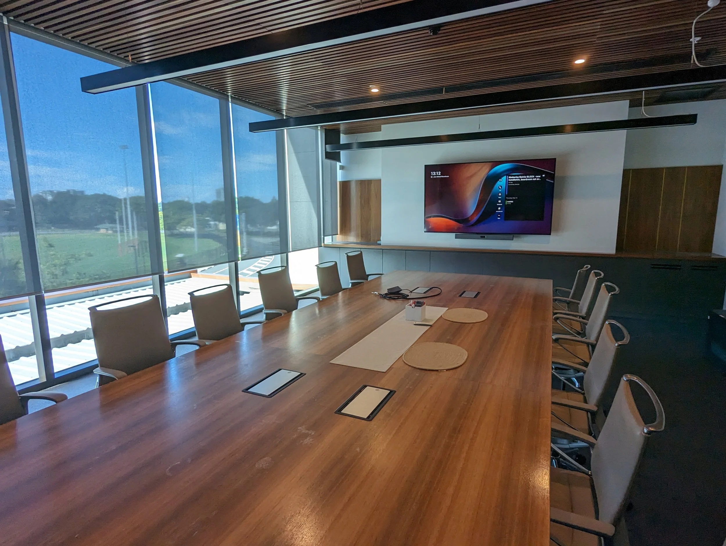 Corporate boardroom with Microsoft Teams Rooms conferencing system.