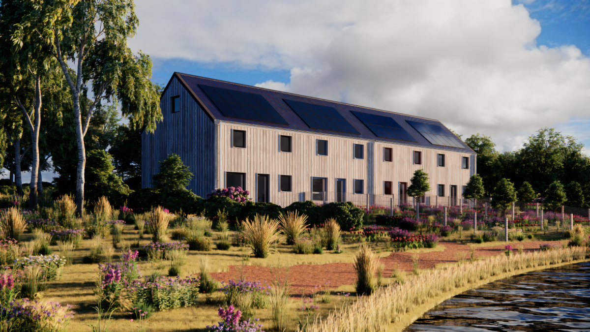 Modern timber multi-story wooden houses in a terrace formation. Spacious and designed to be affordable to build and heat, with solar panels on the roof, surrounded by landscaped gardens and trees near a body of water under a partly cloudy sky.