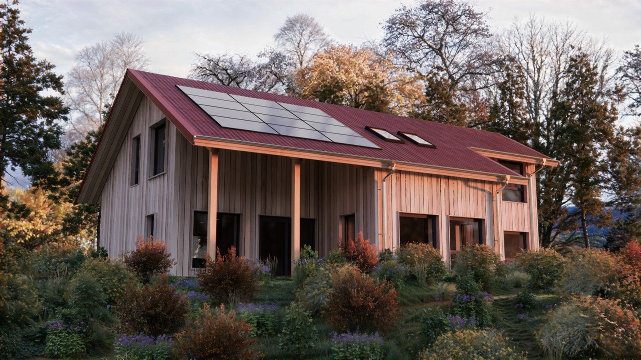 A two-story MAKAR timber home with solar panels on the roof, set in a garden with colourful plants and surrounded by trees.