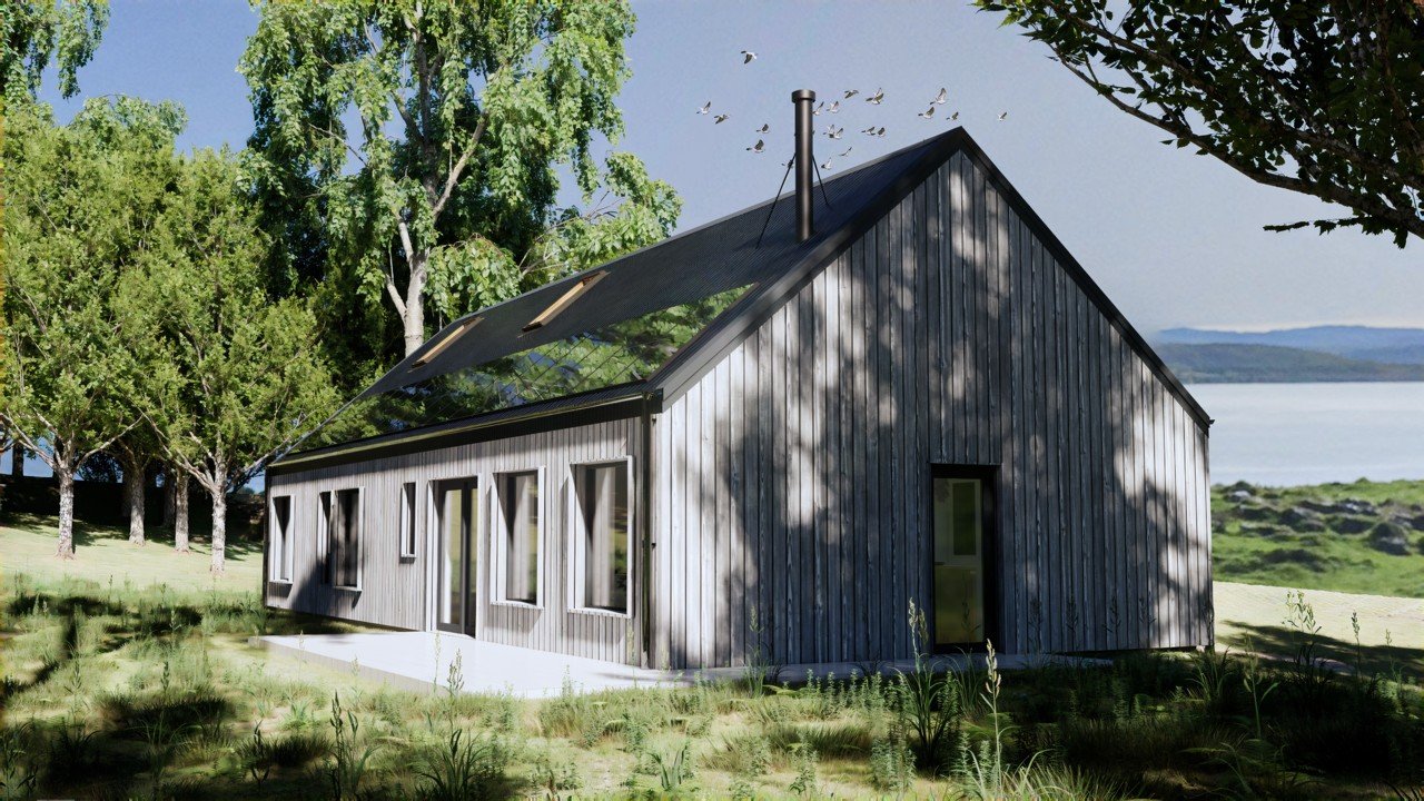 A modern timber longhouse with black metal roofing and larch cladding, surrounded by green trees and grass, with a view of water and distant hills in the background.