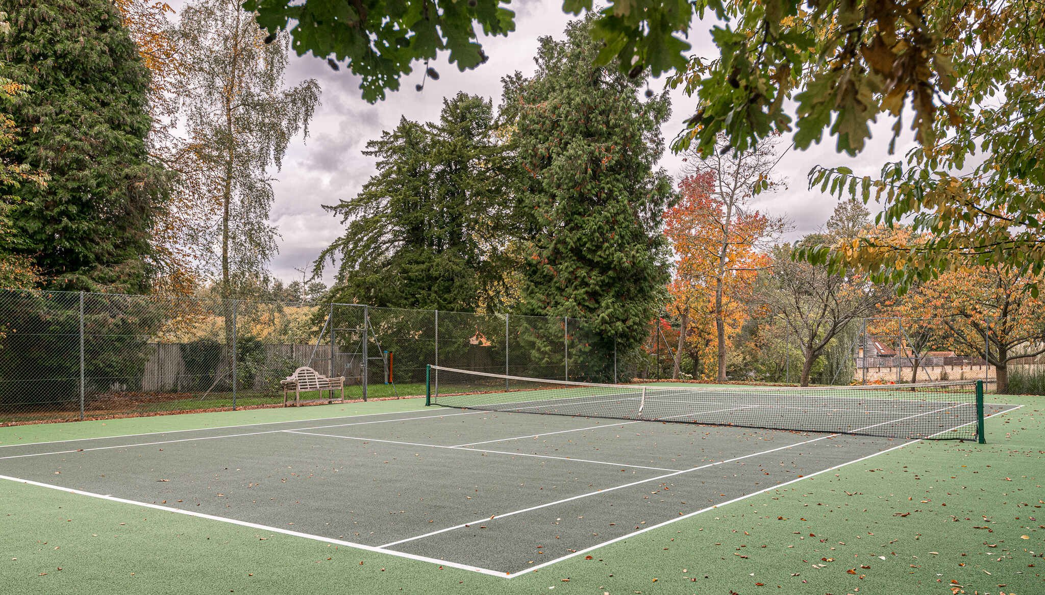 surrey-15-century-country-house-film-photo-shoot-hire-tennis-court-trees.jpg