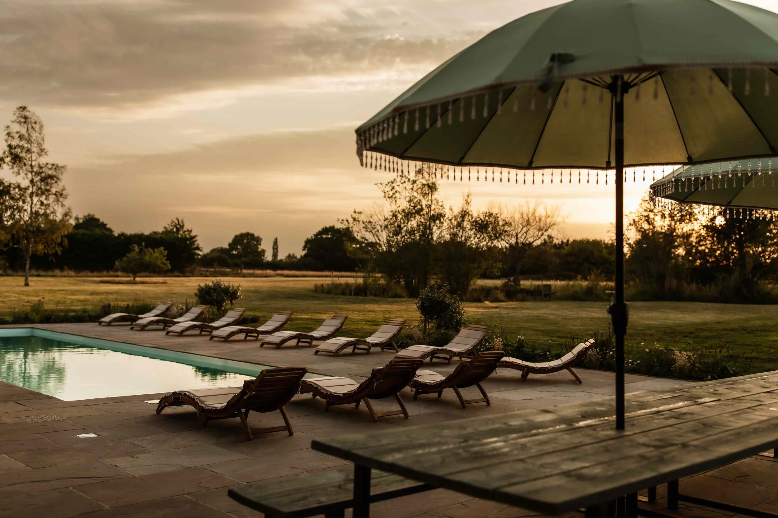 kent-period-manor-house-film-photo-shoot-event-location-unique-venue-hire-outside-pool-sun-loungers.jpg