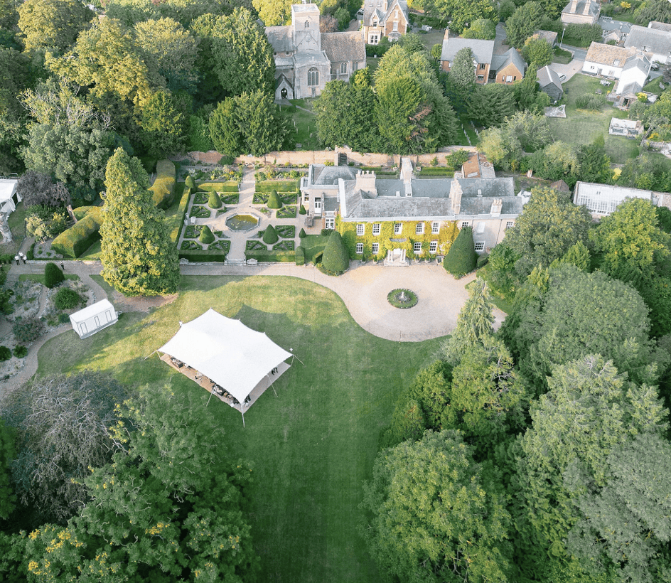 cambridgeshire-stately-period-home-film-photo-shoot-events-hire-aerial-view-marquee.png
